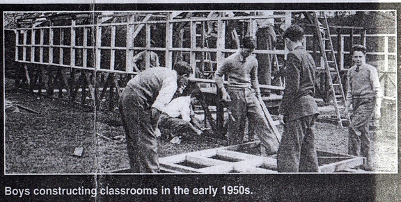 0730, BG 020 aka C57 24B &amp; C57 24C, 7 Oct 1955, Boys constructing classrooms.