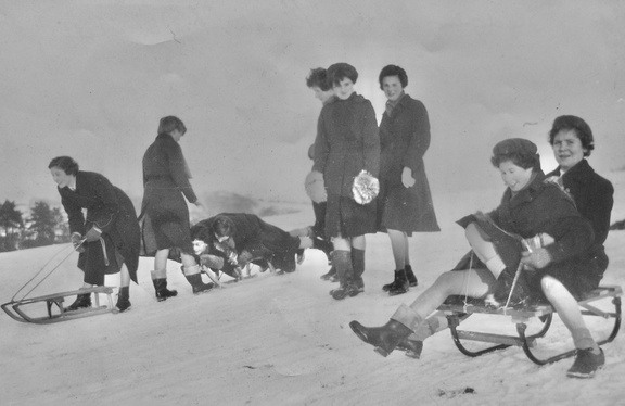 0589.10, EK 007, 17 Feb 1955, Girls sledging on the Punch Bowl hill